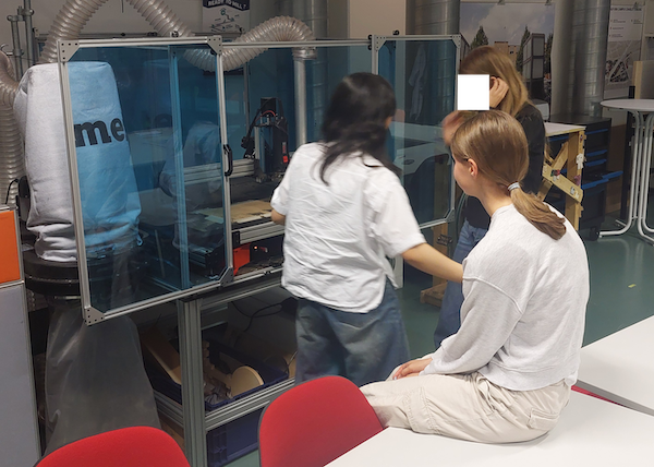 Students using the CNC milling machine.